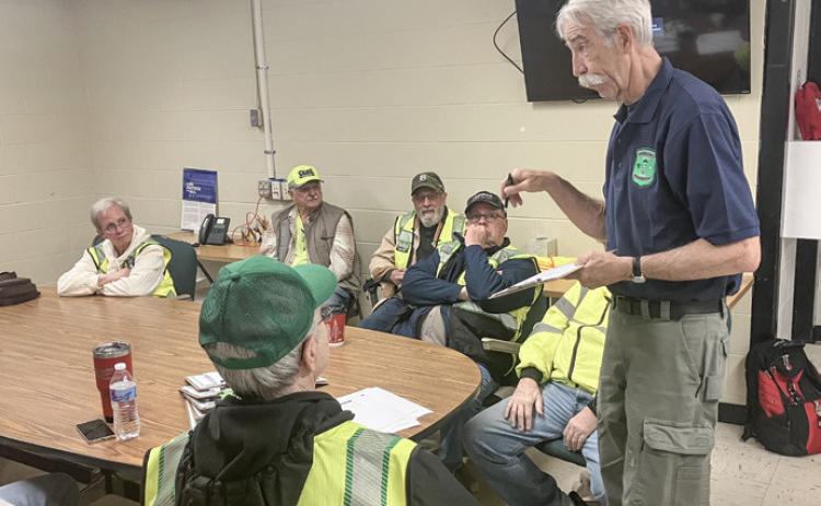 Gladwin County Emergency Management Director Bob North passes out instructions to Community Emergency Response Team volunteers prior to a training exercise that was held Saturday.