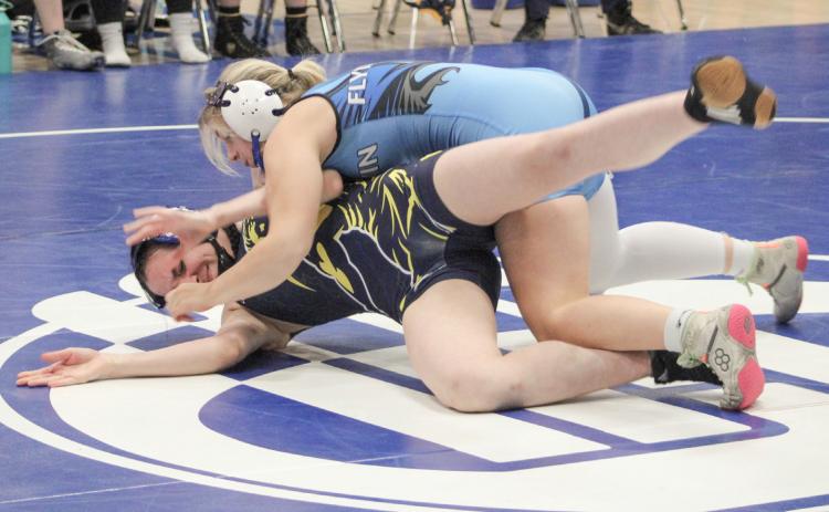 Gladwin’s Lily Miller battled to a second-place finish at 135 at the individual district tournament Sunday to qualify for this weekend’s regional.
