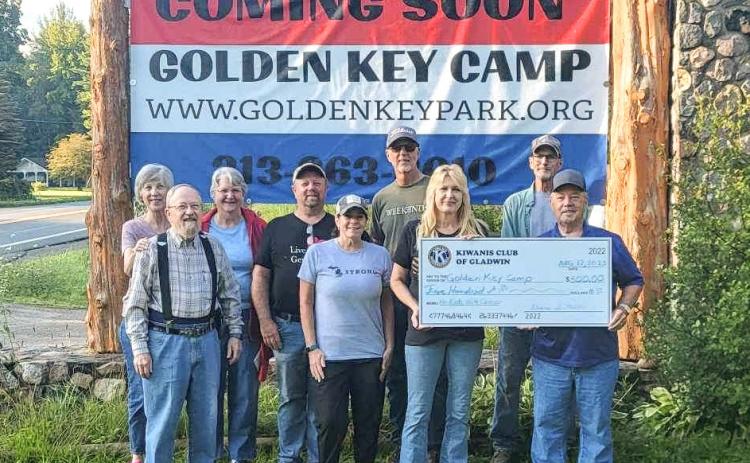Pictured in front row: Duane Miller, Kiwanis; Karen Moore, Kiwanis and Rotary; Lisa Kujawa, Golden Key Camp Founder; Dave Crawford, Kiwanis President, presenting $500 check. Back row: Lori Johnson, Kiwanis; Diana Miller, Kiwanis; Mike Moore, Kiwanis spouse; Al Sawaya, Rotary; and Dave Petherbridge.