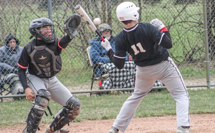 Beaverton’s Landon Love avoids a little chin music during Saturday’s Dar Grove Baseball Tournament.