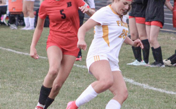 Beaverton’s Piper Carland battles for the ball with an Ogemaw Heights defender last week.