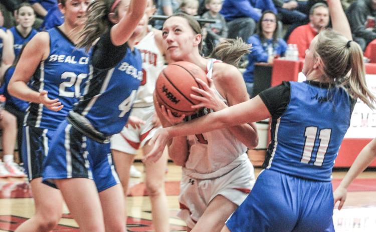 Beaverton’s Trinity Danielak fights her way through the Beal City defense during last Wednesday night’s overtime loss to the Aggies in the Division 3 district semifinals.