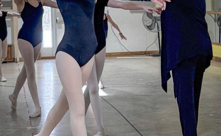 Grade I students clean their arabesque. Pictured with Ms. Bethany is Bryssa Delisle and Ava Adame.